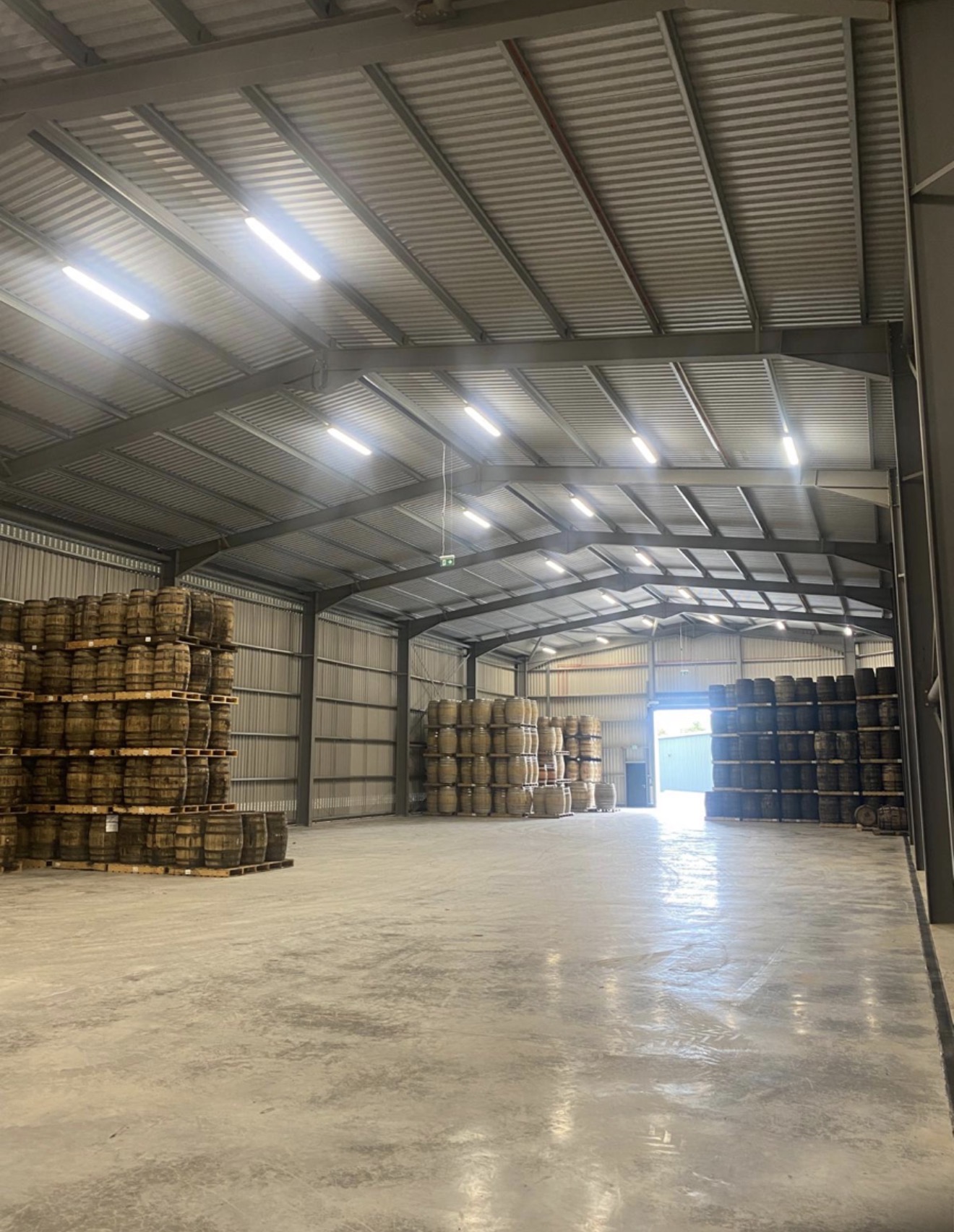 Interior of completed steel portal frame building used for barrel storage